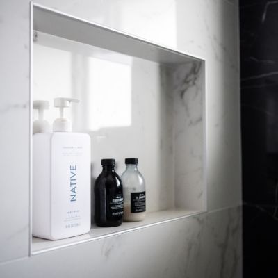 shower niche with white shower tiles